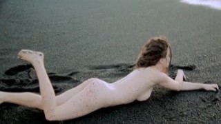 Susann the mermaid gets naked on the beach